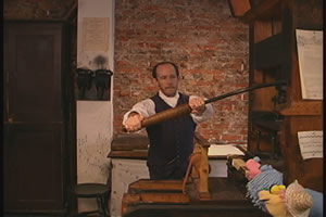 Dave and Augie watch Carl give a Colonial printing demonstration